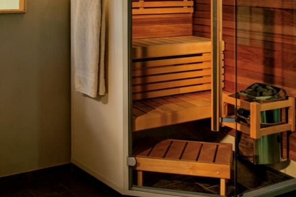 Harvia Vega electric sauna heater mounted on a sauna wall
